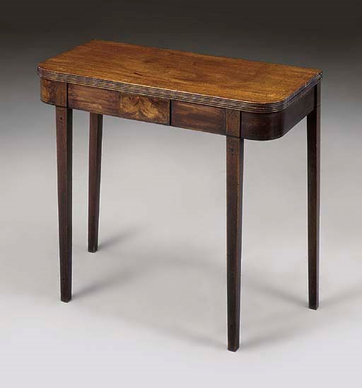 A MAHOGANY GAMES TABLE