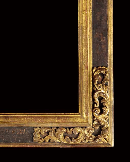 An Italian carved and parcel gilt picture frame