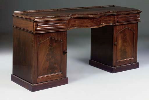 A VICTORIAN MAHOGANY SERPENTINE PEDESTAL SIDEBOARD