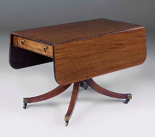 A mahogany and inlaid drop leaf table