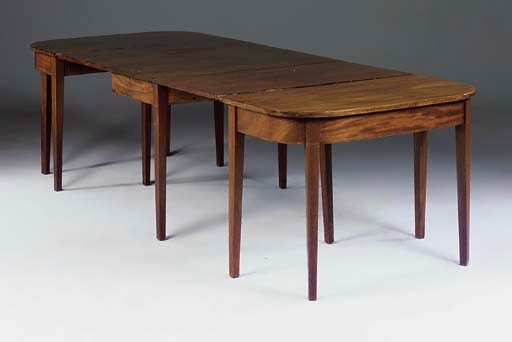 A MAHOGANY D-END DINING TABLE