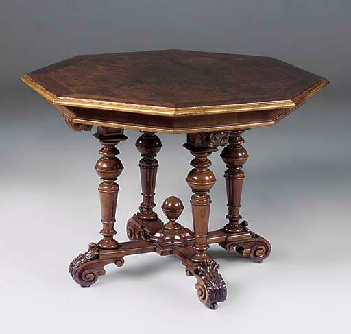 A Victorian walnut and crossbanded octagonal centre table