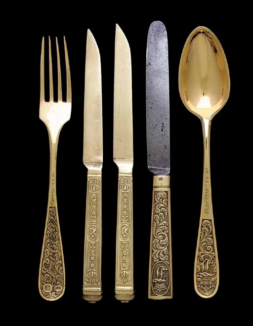A SET OF TWENTY-FOUR FRENCH SILVER-GILT DESSERT KNIVES**