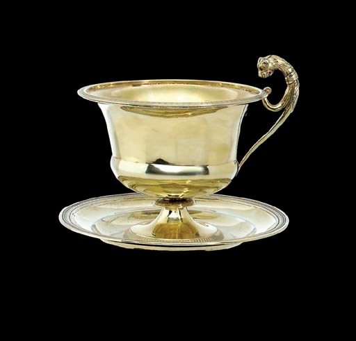 A FRENCH SILVER-GILT CUP AND SAUCER
