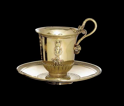 A FRENCH SILVER-GILT CUP AND SAUCER