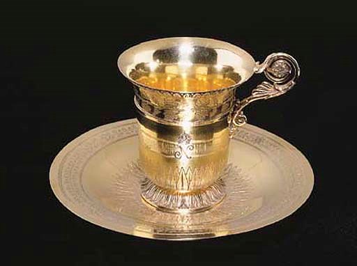 A FRENCH SILVER-GILT CUP AND SAUCER