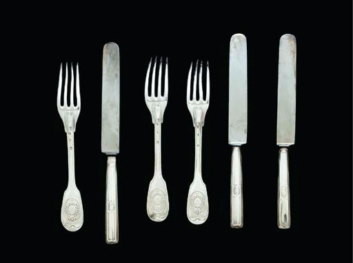 A SET OF TWELVE FRENCH SILVER-GILT FORKS AND TWELVE KNIVES WITH THE ARMS OF LOUIS XVIII