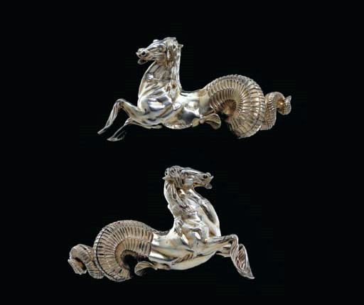 A PAIR OF CONTINENTAL SILVER-GILT HIPPOCAMPS