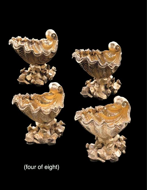 A SET OF EIGHT GEORGE IV SILVER-GILT SALT CELLARS