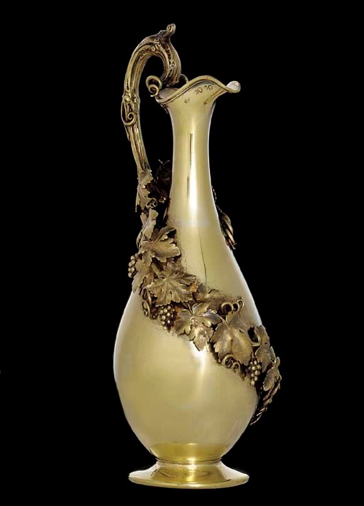 A VICTORIAN SILVER-GILT CLARET JUG