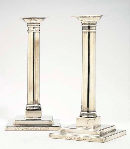 A PAIR OF SILVER CANDLESTICKS,