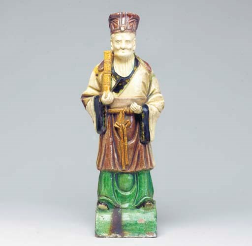 A POLYCHROME-GLAZED POTTERY WORKS TILE FIGURE OF AN IMMORTAL,
