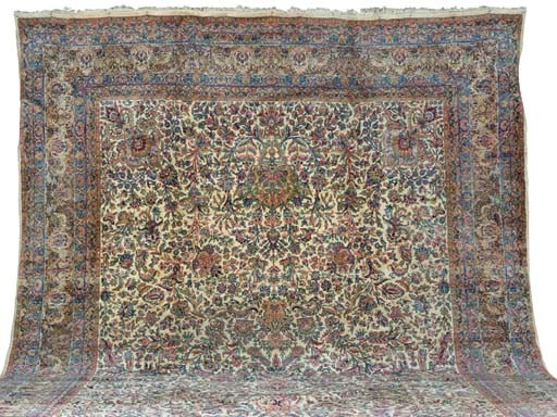 A KIRMAN CARPET,
