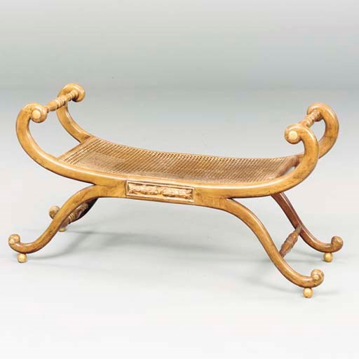 A REGENCY MAHOGANY STYLE CANED WINDOW BENCH