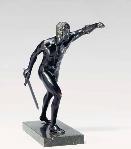 AFTER THE ANTIQUE, A PATINATED BRONZE FIGURE OF A WARRIOR ON GREY MARBLE BASE