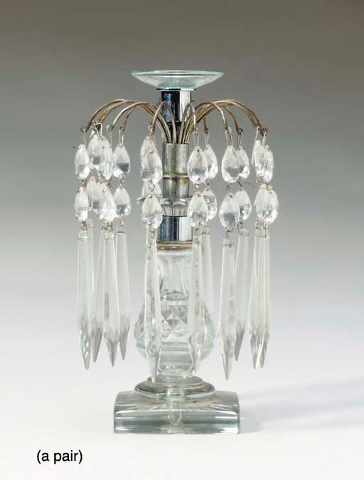 A PAIR OF REGENCY STYLE CUT GLASS CANDLESTICKS,
