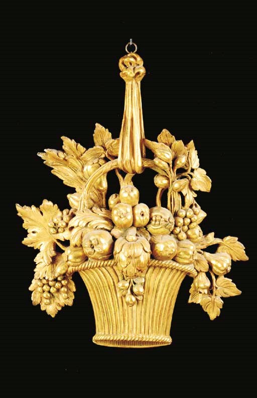 A COMPOSITION GILTWOOD TROPHY DEPICTING BASKET OF FRUIT