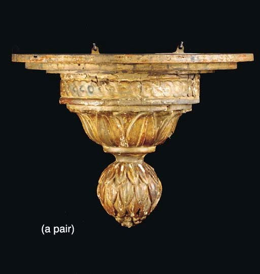 A PAIR OF CONTINENTAL NEOCLASSIC STYLE GILTWOOD WALL BRACKETS, COMPOSED OF OLD ELEMENTS