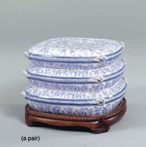 A PAIR OF BLUE AND WHITE CERAMIC CUSHION FORM SEATS