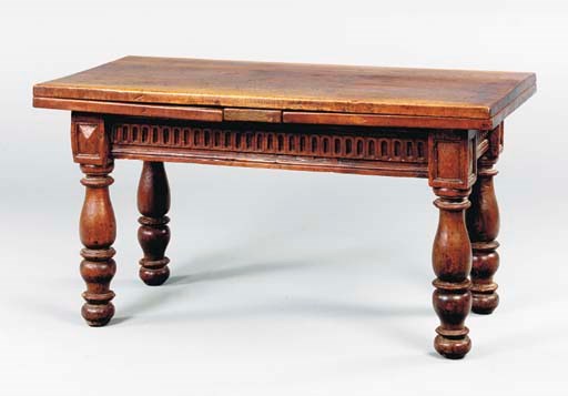A SWISS BAROQUE STYLE WALNUT DRAW LEAF TABLE,