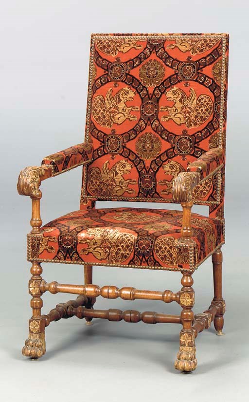 A BAROQUE STYLE WALNUT ARMCHAIR WITH RED VELVET UPHOLSTERY,