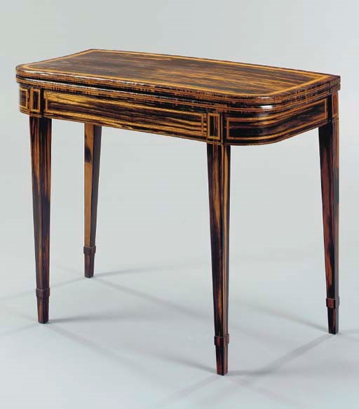A REGENCY CALAMANDER AND SATINWOOD GAMES TABLE,