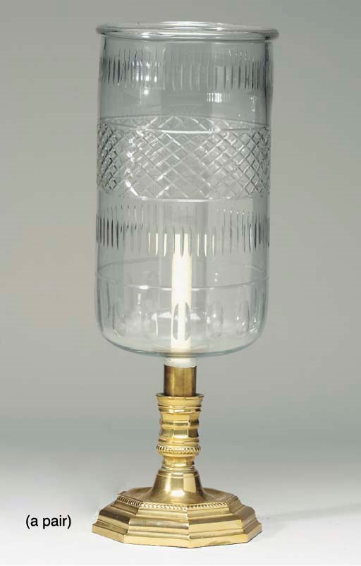 A PAIR OF BRASS CANDLESTICKS NOW MOUNTED AS LAMPS,