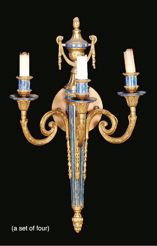 A GROUP OF FOUR LOUIS XVI STYLE GILT BRONZE AND FAUX LAPIS DECORATED THREE BRANCH WALL LIGHTS,
