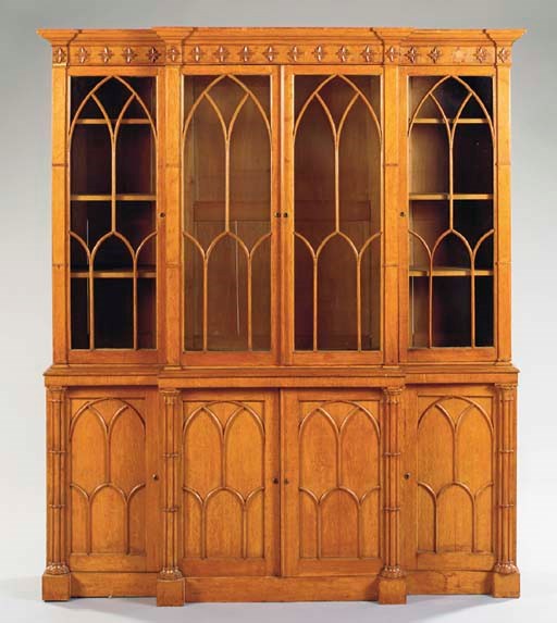 A VICTORIAN OAK GOTHIC REVIVAL BREAKFRONT BOOKCASE,