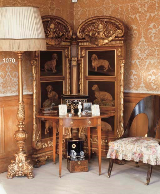 AN ITALIAN CARVED GILTWOOD STANDARD LAMP