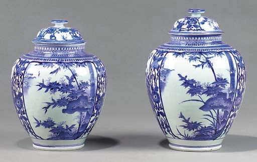 TWO SIMILAR ARITA BLUE AND WHITE BALUSTER JARS AND COVERS