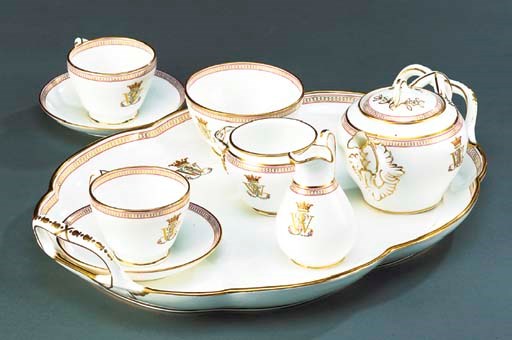 AN ENGLISH PORCELAIN MONOGRAMMED CABARET