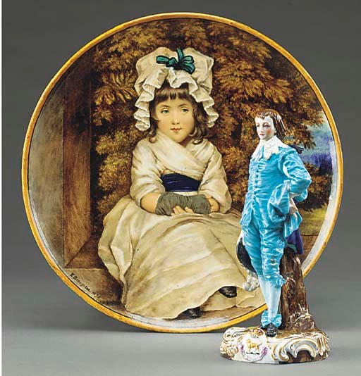 A MINTONS POTTERY CHARGER DECORATED BY 'E.BROUGHTON'