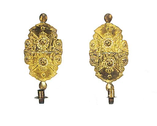 A pair of Continental repoussé brass wall sconces