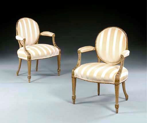 A PAIR OF GEORGE III GREY-PAINTED AND PARCEL-GILT OPEN ARMCHAIRS