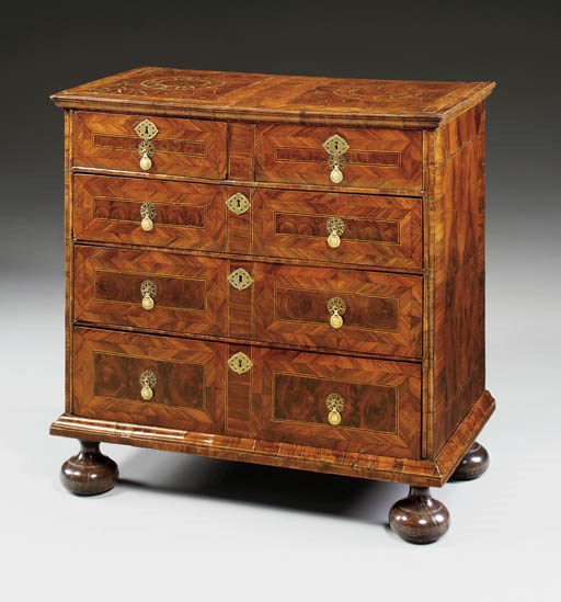 A WILLIAM AND MARY OYSTER-VENEERED WALNUT CHEST-OF-DRAWERS