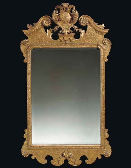 A GEORGE II GILTWOOD MIRROR