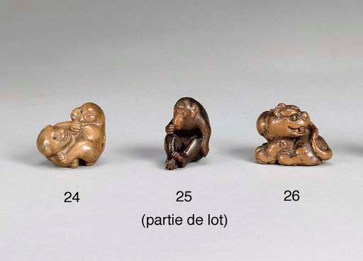 NETSUKE EN BOIS SIGNE MINKO