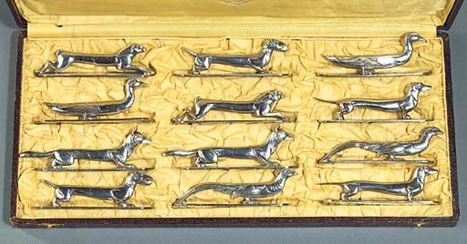 A FRENCH CASED SET OF TWELVE ANIMAL KNIFE RESTS