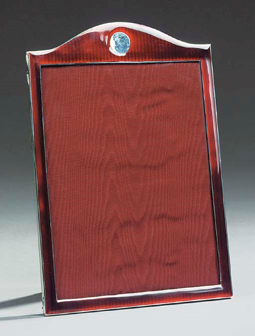 A SILVER AND RED ENAMEL PHOTOGRAPH FRAME