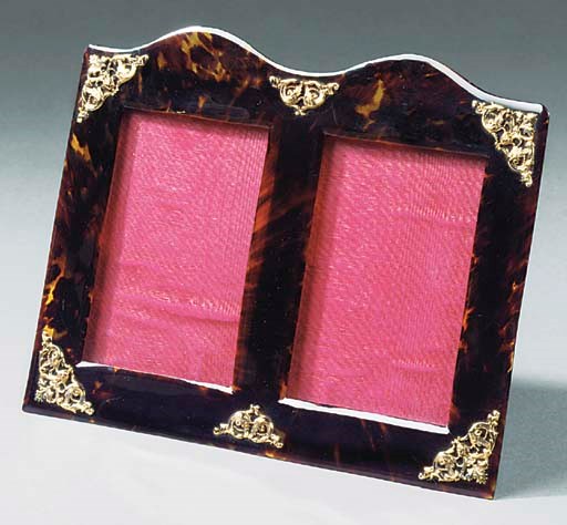 A LATE VICTORIAN OR EDWARDIAN TORTOISESHELL DOUBLE PHOTOGRAPH FRAME