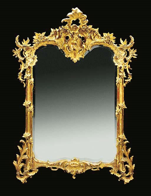 A FRENCH GILT COMPOSITION MIRROR