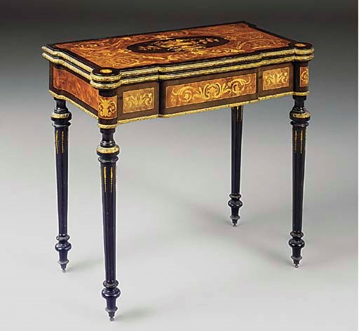 A NAPOLEON III ORMOLU MOUNTED AND EBONISED STAINED PEARWOOD AMBOYNA AND MARQUETRY GAMES TABLE