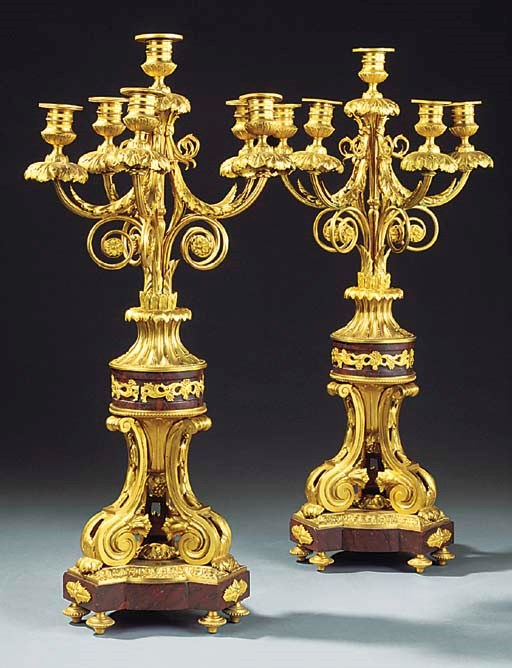 A PAIR OF FRENCH GILT BRONZE AND ROUGE GRIOTTE MARBLE SIX LIGHT CANDELABRA