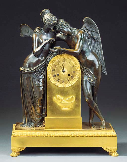 A FRENCH GILT AND PATINATED BRONZE MANTEL CLOCK