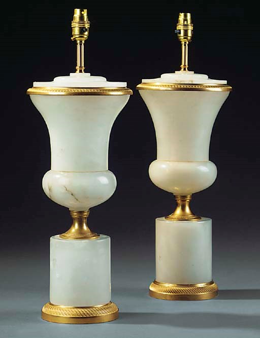 A PAIR OF GILT METAL AND ALABASTER TABLE LAMPS