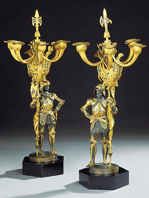 A PAIR OF GILT AND PATINATED BRONZE FIGURAL SIX LIGHT CANDELABRA