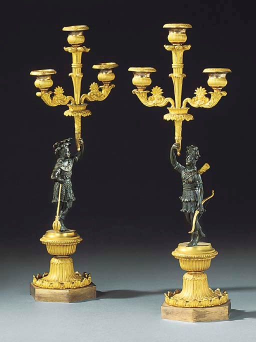 A PAIR OF LOUIS PHILIPPE ORMOLU AND BRONZE THREE LIGHT CANDELABRA