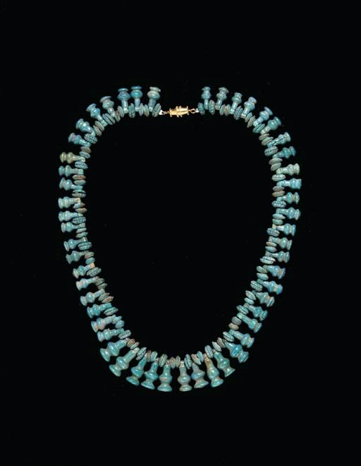 AN EGYPTIAN FAIENCE BEAD NECKLACE