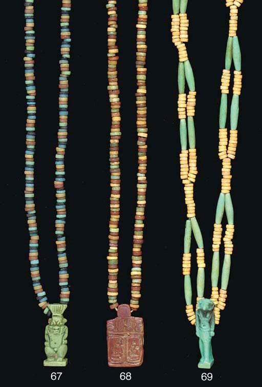 AN EGYPTIAN FAIENCE AMULET OF BES